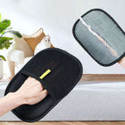 Reusable pet hair remover glove used on furniture and clothing. Efficiently lifts pet hair with electrostatic bristles.