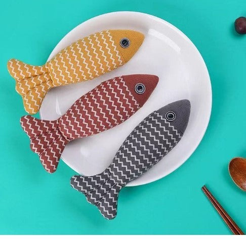 Set of three Cat Toy Funny Cat Linen Fish Pillows in yellow, red, and gray on a white plate, ideal for interactive cat play.